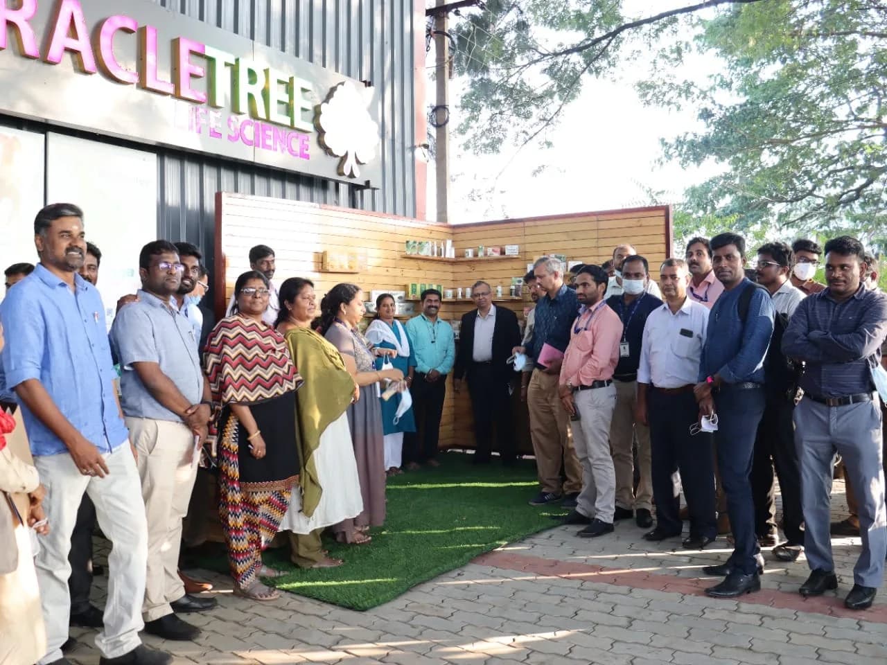 A gathering outside the Miracle Tree Life Science premises