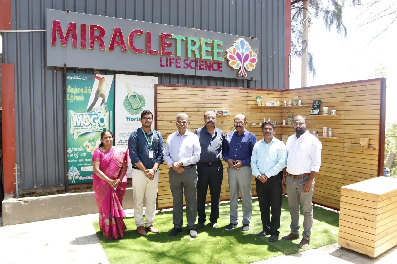The Miracle Tree Life Science building with a visiting group outside