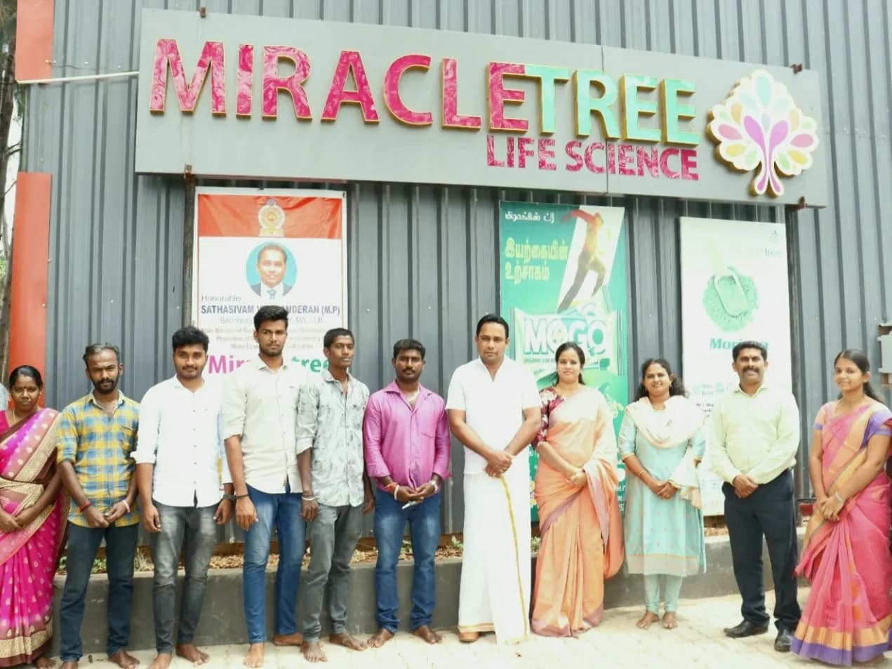 A group photographed outside the Miracle Tree Life Science premises