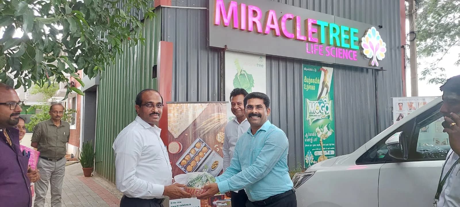 A MOGO product pack being presented outside the premises