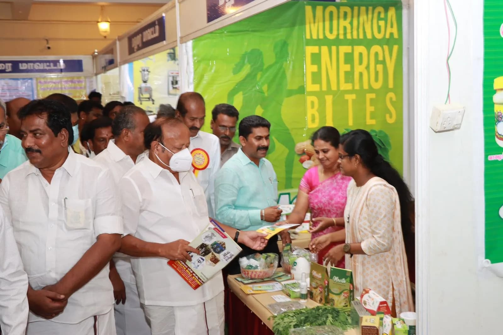 Visitors at a Moringa Energy Bites exhibition stand