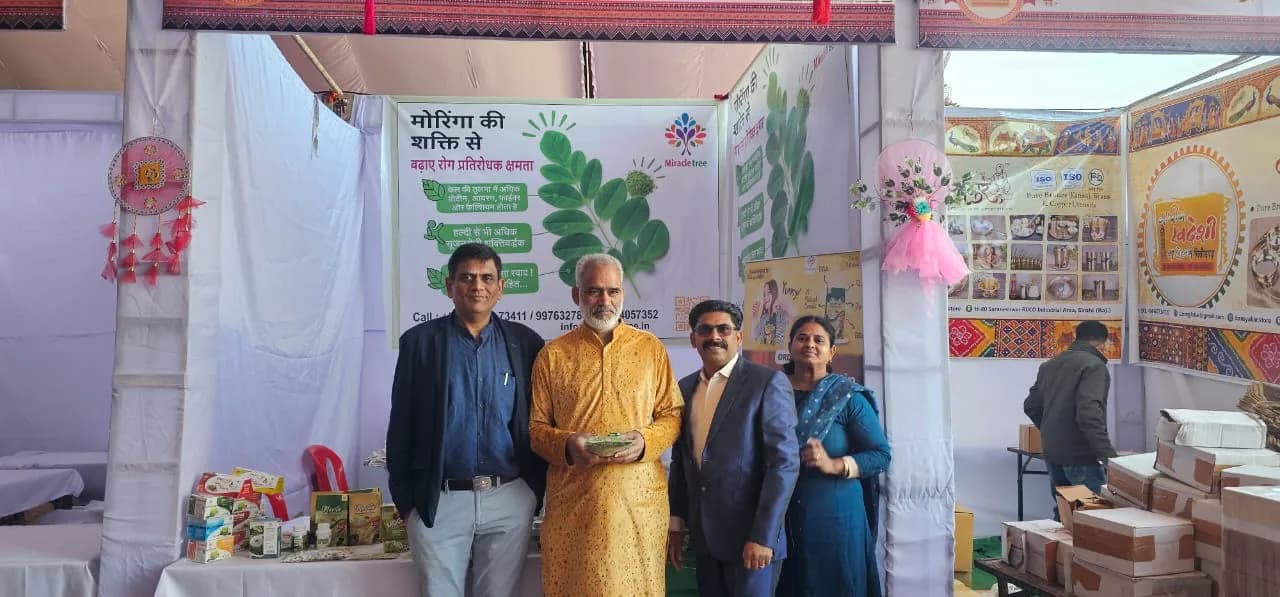 A group at a MiracleTree exhibition stand